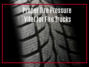 Blurred close up view of black tire tread with words "Proper Tire Pressure Vital for Fire Trucks"