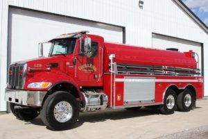 Full body view of red tanker fire truck